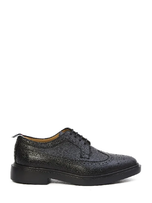 Casual shoes for casual appeal -THOM BROWNE Laced Longwing Brogues for Men